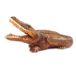A Continental ceramic alligator money box, stamped Foreign, 20cm wide.