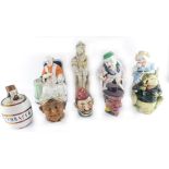 A group of novelty tobacco jars, to include a frog, seated man with a pip, seated Papal figure, etc.