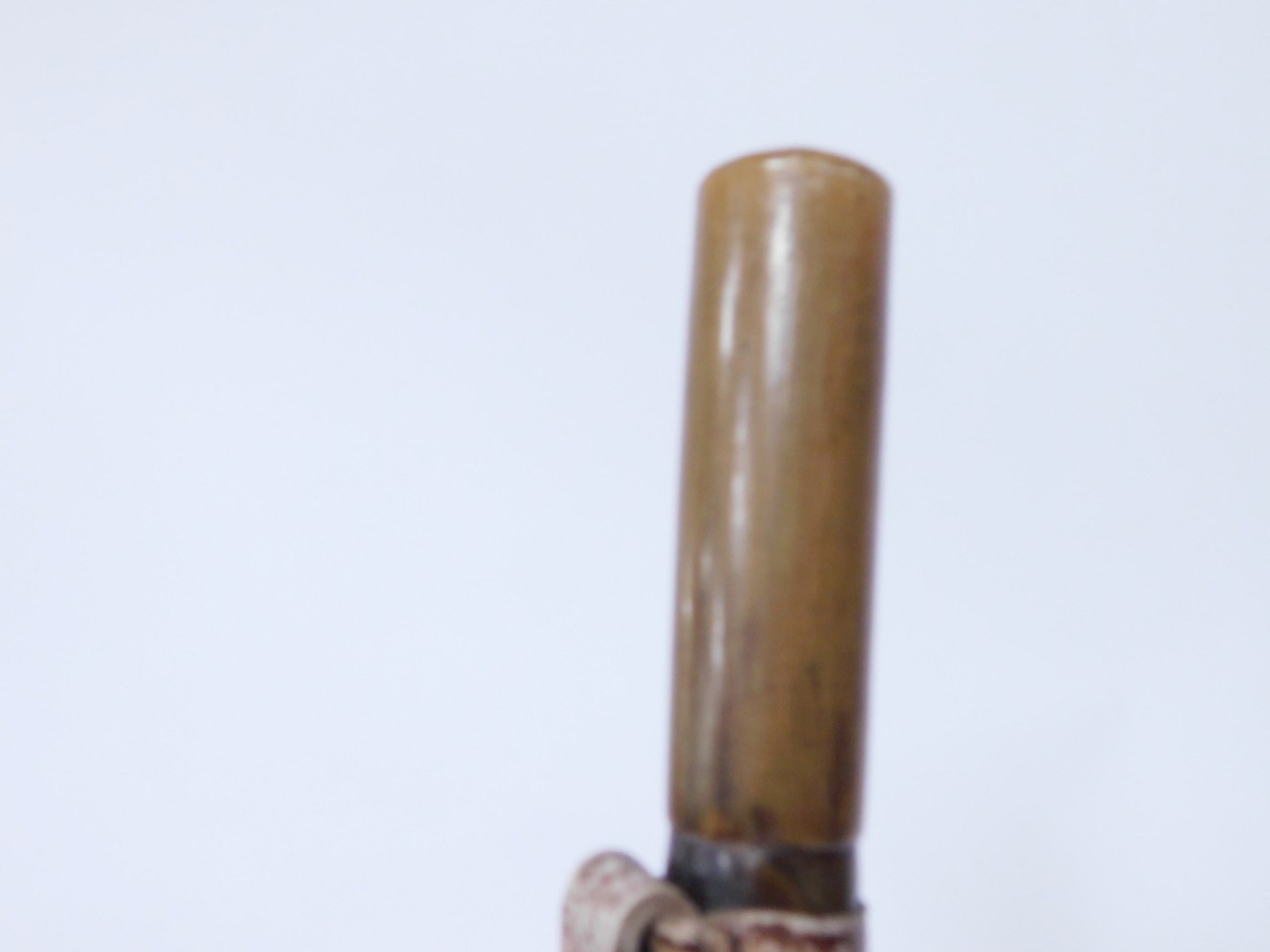 A horn walking stick, early 20thC, with leather strop, 81cm wide, together with a bamboo walking - Image 3 of 4