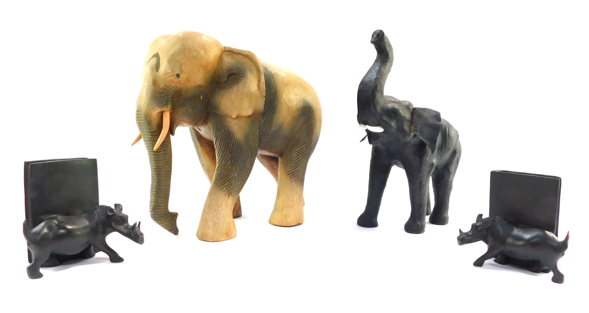 A group of carved wooden ornaments, comprising a large elephant 33cm high, a black stained