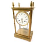 A 19thC brass four glass mantel clock, with four acorn finial top