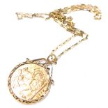 An Edward VII full gold sovereign pendant and chain, dated 1903, in a 9ct gold frame, with 9ct