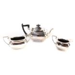 A Walker & Hall silver plated three piece tea service, comprising teapot, milk jug and sucrier,