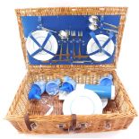 A 1970's/1980's picnic hamper, with contents of Brexton flask, and Melamine four place setting, etc,