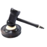 WITHDRAWN Presale for vendor. A lignum vitae gavel and block, with a turned handle, and stand. (2)