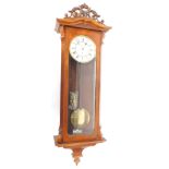 A late 19thC walnut cased Vienna wall clock, circular enamel dial bearing Roman numerals, thirty