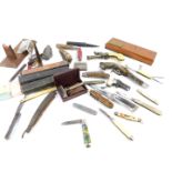 A group of novelty penknives, pistols and razors, to include bone handled and horn handled knives,