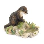 A Border Fine Arts Reflection figure, of a seated otter, MTR02, 8cm high. (AF)