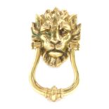 A 19thC brass door knocker, formed with a lion mask handle, 23cm high.