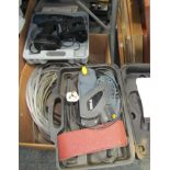 Power tools and cabling, a Titan 3" belt sander, and a Ferm cordless drill with additional