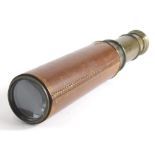 A 20thC Britannic Co three draw telescope with brown leather end, when closed 16cm long.