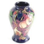 20thC Moorcroft Vase decorated with fruit and berries impressed and painted marks beneath, 26cm high