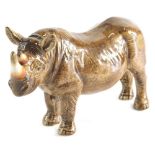 A John Beswick figure of a rhinoceros, signature mark beneath, 11cm high.