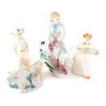 Four 20thC Ukrainian porcelain figures, to include girl playing squeeze box wearing orange hat, 12cm