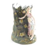 A Continental bisque figure spill vase group, of lady and child before floral decoration, with gilt