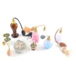 Various perfume atomizers, etc., one with floral top, 9cm high, various others, and a bisque porcela