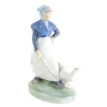 A Royal Copenhagen figure of a lady aside goose, number 067, marked beneath, 20cm high.