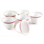 A set of six Russian porcelain tea bowls, sparsely decorated with brown banding, 6cm diameter. (6)