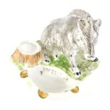 A 20thC Ukrainian porcelain boar ashtray, polychrome decorated in grey and green with gilt highlight