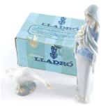 A Lladro figure of a lady, in flowing robes holding flowers, 24cm high, and a Lladro figure of a goo