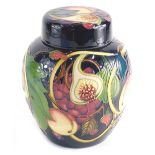 A 20thC Moorcroft Pottery Ginger Jar & Cover with fruit and flowers, pressed marks beneath, 24cm hig