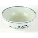 An 18thC Liverpool porcelain blue and white bowl, with a floral decoration on circular foot, labelle
