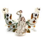 Various Staffordshire pottery, a pair of spaniel figures with gilt highlights and yellow eyes, with