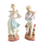 A pair of early 20thC Austrian bisque figures, of a lady and gentleman each dressed in finery, on sc