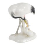 A Noritake figure of a crane and young, marked beneath, 19cm high.