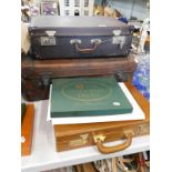 Miscellaneous items, to include a leather briefcase with combination, various placemats, leather
