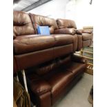 A brown leather three piece suite, comprising three seat sofa, two seat sofa, and a chair.