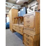 A wood effect wardrobe, matching dressing table, two bedside tables and a 1960's coffee table. (5)