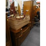 A small oak wardrobe and a dressing table.