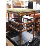 An Edwardian walnut piano stool, with under tier.