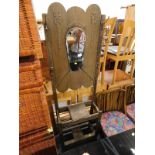 An oak hallstand with a shaped bevelled mirror plate (AF)