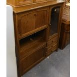 A small oak unit, with part cocktail cabinet display, etc.