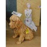 A Coalport porcelain figure of Gail, and a seated Sylvac dog.