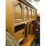 A large Continental oak room unit with panelled doors, etc. Buyer Note: WARNING! This lot contains