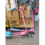 Two pink child's scooters. (2)