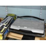 A laptop grill, and a tile cutter.