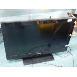 A Toshiba 31" LCD TV/DVD with remote control.