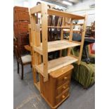 Two pine shelving units, and a pine three drawer cabinet.