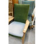 A 1950's/1960's open armchair and a wingback chair. The upholstery in this lot does not comply