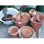 A quantity of terracotta pots, Suffolk Swift push mower, etc.