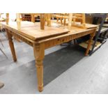 A pine extending dining table. (AF)