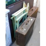 A director's chair with floral pattered fabric, a mahogany tool chest, and a suitcase.