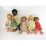 Various 20thC dolls, to include celluloid with sleep eyes, black doll, a quantity of books, Jill and