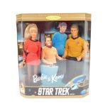 A Mattel Star Trek 30th Anniversary gift set, including Barbie and Ken in Starfleet uniforms, with a