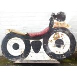 A fairground ride wooden motorcycle, marked OLU.8, painted in white and black, on metal framed base