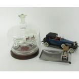Automobilia trinkets, comprising a glass car in case, ashtray with car emblem and a battery powered